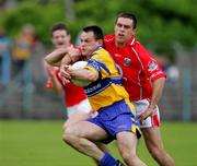 12 June 2005; Odran O'Dwyer, Clare, in action against Martin Cronin, Cork. Bank of Ireland Munster Senior Football Championship Semi-Final, Clare v Cork, Cusack Park, Ennis, Co. Clare. Picture credit; Kieran Clancy / SPORTSFILE