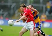 12 June 2005; Conor McCarthy, Cork, in action against Alan Clohessy, Clare. Bank of Ireland Munster Senior Football Championship Semi-Final, Clare v Cork, Cusack Park, Ennis, Co. Clare. Picture credit; Kieran Clancy / SPORTSFILE