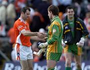 12 June 2005; Michael Boyle, Donegal goalkeeper, shakes hands with Armagh's Steven McDonnell at the end of the match. Bank of Ireland Ulster Senior Football Championship Semi-Final, Donegal v Armagh, St. Tighernach's Park, Clones, Co. Monaghan. Picture credit; Damien Eagers / SPORTSFILE