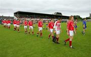 12 June 2005; The Cork and Clare players during the pre-match parade. Bank of Ireland Munster Senior Football Championship Semi-Final, Clare v Cork, Cusack Park, Ennis, Co. Clare. Picture credit; Kieran Clancy / SPORTSFILE
