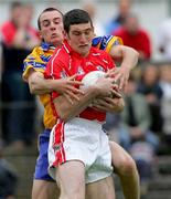 12 June 2005; Noel O'Leary, Cork, in action against Rory Donnelly, Clare. Bank of Ireland Munster Senior Football Championship Semi-Final, Clare v Cork, Cusack Park, Ennis, Co. Clare. Picture credit; Kieran Clancy / SPORTSFILE