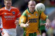 12 June 2005; Adrian Sweeney, Donegal, in action against Francie Bellew, Armagh. Bank of Ireland Ulster Senior Football Championship Semi-Final, Donegal v Armagh, St. Tighernach's Park, Clones, Co. Monaghan. Picture credit; Damien Eagers / SPORTSFILE