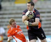 12 June 2005; Paul Hearty, Armagh goalkeeper supported by team-mate Francie Bellew. Bank of Ireland Ulster Senior Football Championship Semi-Final, Donegal v Armagh, St. Tighernach's Park, Clones, Co. Monaghan. Picture credit; Damien Eagers / SPORTSFILE