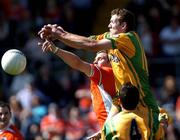 12 June 2005; Raymond Sweeney, Donegal contests a high ball with John McEntee, Armagh. Bank of Ireland Ulster Senior Football Championship Semi-Final, Donegal v Armagh, St. Tighernach's Park, Clones, Co. Monaghan. Picture credit; Damien Eagers / SPORTSFILE