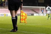 12 June 2005; An assistant referee carries a flag. FAI Carlsberg Cup 2nd Round, Shamrock Rovers v Fanad United, Dalymount Park, Dublin. Picture credit; David Maher / SPORTSFILE