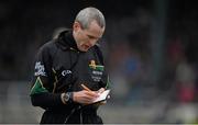 26 January 2014; Referee Fergal Kelly makes a note of a player's number in his notebook. Bord na Mona O'Byrne Cup, Final, Kildare v Meath. St Conleth's Park, Newbridge, Co. Kildare. Picture credit: Brendan Moran / SPORTSFILE