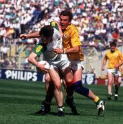 28 July 1991; Ken Kellaghan of Offaly in action against Colm O'Rourke of Meath during the  Leinster Senior Football Championship Semi-Final match between Meath and Offaly at Croke Park in Dublin. Photo by Ray McManus/Sportsfile