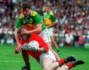 28 September 1997; Mayo goalkeeper Peter Burke is tackled by Denis O'Dwyer of Kerry during the GAA Football All-Ireland Senior Championship Final match between Kerry and Mayo at Croke Park in Dublin. Photo by Brendan Moran/Sportsfile