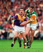 22 June 1997; Kevin Martin of Offaly in action against Martin Storey of Wexford during the GAA Leinster Senior Hurling Championship Semi-Final match between Wexford and Offaly at Croke Park in Dublin. Photo by Ray McManus/Sportsfile