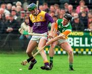 23 March 1997; Larry Murphy of Wexford in action against Brian Whelahan of Offaly during the National Hurling League Division 1 match between Offaly and Wexford at St. Brendan's Park in Birr, Offaly. Photo by David Maher/Sportsfile
