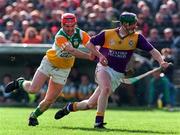 23 March 1997; Larry Murphy of Wexford in action against Martin Hanamy of Offaly during the National Hurling League Division 1 match between Offaly and Wexford at St. Brendan's Park in Birr, Offaly. Photo by David Maher/Sportsfile