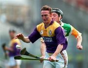23 March 1997; Larry Murphy of Wexford in action against Brian Whelahan of Offaly during the National Hurling League Division 1 match between Offaly and Wexford at St. Brendan's Park in Birr, Offaly. Photo by David Maher/Sportsfile