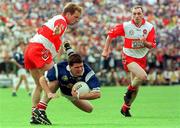 20 July 1997; Larry Reilly of Cavan in action against Kieren McKeever, left, and Henry Downey of Derry during the Ulster GAA Football Senior Championship Final match between Cavan and Derry at St. Tiernach's Park in Clones, Monaghan. Photo by David Maher/Sportsfile