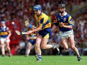6 July 1997; Liam Doyle of Clare in action against Tomas Dunne of Tipperary during the GAA Munster Senior Hurling Championship Final match between Clare and Tipperary at Páirc Uí Chaoimh in Cork. Photo by Ray McManus/Sportsfile