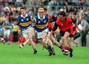 26 July 1997; Martin Coulter Sr of Down in action against Liam Cahill of Tipperary during the GAA All-Ireland Senior Hurling Championship Quarter-Final match between Tipperary and Down at St. Tiernach's Park in Clones, Monaghan. Photo by David Maher/Sportsfile