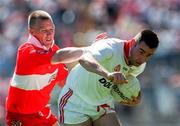 29 June 1997; Matt McGleenan of Tyrone in action against Johnny McBride of Derry during the Ulster GAA Football Senior Championship Semi-Final match between Tyrone and Derry at St. Tiernach's Park in Clones, Monaghan. Photo by David Maher/Sportsfile