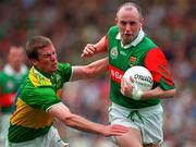 28 September 1997; Pat Holmes of Mayo is tackled by Dara O'Cinneide of Kerry during the GAA Football All-Ireland Senior Championship Final match between Kerry and Mayo at Croke Park in Dublin. Photo by Brendan Moran/Sportsfile