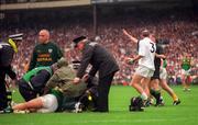 3 August 1997; Davy Dalton of Kildare is sent off by referee Pat O'Toole as Brendan Reilly of Meath receives medical attention during the Leinster GAA Senior Football Championship Semi-Final Second Replay match between Kildare and Meath at Croke Park in Dublin. Photo by Ray McManus/Sportsfile