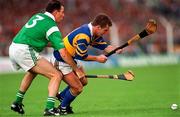 15 June 1997; Michael Cleary of Tipperary in action against Mike Nash of Limerick during the Munster GAA Senior Hurling Championship Semi-Final match between Tipperary and Limerick at Semple Stadium in Thurles. Photo by Ray McManus/Sportsfile