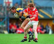 22 June 1997; Michael Hynes of Clare in action against Aidan Dorgan of Cork during the GAA Munster Senior Football Championship Semi-Final match between Clare and Cork at Cusack Park in Ennis, Clare. Photo by Brendan Moran/Sportsfile