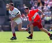 29 June 1997; Noel Donnelly of Tyrone in action against Fergal McCusker of Derry during the Ulster GAA Football Senior Championship Semi-Final match between Tyrone and Derry at St. Tiernach's Park in Clones, Monaghan. Photo by David Maher/Sportsfile