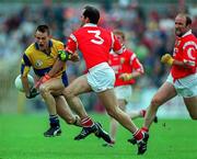 22 June 1997; Odhran O'Dwyer of Clare in action against Mark O'Connor, centre, and Brian Corcoran of Cork during the GAA Munster Senior Football Championship Semi-Final match between Clare and Cork at Cusack Park in Ennis, Clare. Photo by Brendan Moran/Sportsfile