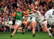 3 August 1997; Ollie Murphy of Meath shoots for a score despite the attention of Willie McCreery of Kildare during the Leinster GAA Senior Football Championship Semi-Final Second Replay match between Kildare and Meath at Croke Park in Dublin. Photo by Ray McManus/Sportsfile