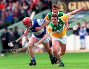 8 June 1997; Owen Coss of Laois in action against Kevin Martin of Offaly during the GAA Leinster Senior Hurling Championship Quarter-Final match between Offaly and Laois at Croke Park in Dublin. Photo by David Maher/Sportsfile