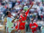 29 June 1997; Pascal Canavan of Tyrone in action against Henry Downey of Derry during the Ulster GAA Football Senior Championship Semi-Final match between Tyrone and Derry at St. Tiernach's Park in Clones, Monaghan. Photo by David Maher/Sportsfile