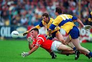 22 June 1997; Pat Hegarty of Cork in action against Francis McInerney, right, and Ger Keane of Clare during the GAA Munster Senior Football Championship Semi-Final match between Clare and Cork at Cusack Park in Ennis, Clare. Photo by Brendan Moran/Sportsfile