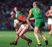 15 September 1996; Pat Holmes of Mayo in action against Graham Geraghty of Meath during the All-Ireland Senior Football Championship Final match between Mayo and Meath at Croke Park in Dublin. Photo by David Maher/Sportsfile