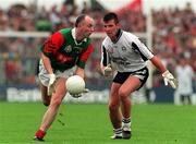 3 August 1997; Pat Holmes of Mayo, in action against Paul Taylor of Sligo during the GAA Connacht Senior Football Championship Final match between Mayo and Sligo at Dr. Hyde Park in Roscommon. Photo by David Maher/Sportsfile