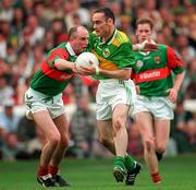 28 September 1997; Pa Laide of Kerry is tackled by Pat Holmes of Mayo during the GAA Football All-Ireland Senior Championship Final at Croke Park in Dublin. Photo by David Maher/Sportsfile