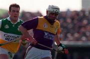 23 March 1997; Paul Codd of Wexford in action against Kevin Martin of Offaly during the National Hurling League Division 1 match between Offaly and Wexford at St. Brendan's Park in Birr, Offaly. Photo by David Maher/Sportsfile