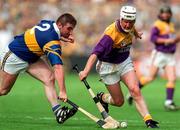 17 August 1997; Tom Dempsey of Wexford in action against Paul Shelly Tipperary during the GAA All-Ireland Senior Hurling Championship Semi-Final match between Tipperary and Wexford at Croke Park in Dublin. Photo by David Maher/Sportsfile