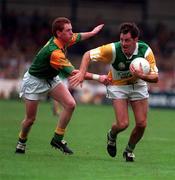 28 May 1995; Peter Brady of Offaly in action against Donal Curtis of Meath during the Leinster Senior Football Championship Preliminary Round between Meath and Offaly in Pairc Tailteann, Navan. Photo by Ray McManus/Sportsfile
