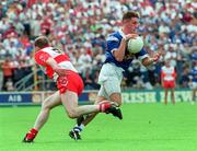 20 July 1997; Ray Cunningham of Cavan in action against Henry Downey of Derry during the Ulster GAA Football Senior Championship Final match between Cavan and Derry at St. Tiernach's Park in Clones, Monaghan. Photo by David Maher/Sportsfile