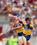 6 July 1997; Raymie Ryan of Tipperary in action against P.J O'Connell of Clare during the GAA Munster Senior Hurling Championship Final match between Clare and Tipperary at Páirc Uí Chaoimh in Cork. Photo by Ray McManus/Sportsfile