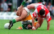 29 June 1997; Roy Malone of Offaly is tackled by Gareth O'Neill of Louth during the Leinster GAA Senior Football Championship Semi-Final match between Offaly and Louth at Páirc Tailteann in Navan, Meath. Photo by Ray McManus/Sportsfile