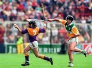 22 June 1997; Sean Flood Wexford in action against Billy Dooley of Offaly during the GAA Leinster Senior Hurling Championship Semi-Final match between Wexford and Offaly at Croke Park in Dublin. Photo by Ray McManus/Sportsfile