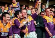 13 July 1997; Wexford players celebrate, from left, Liam Dunne, Sean Flood, Tom Dempsey, and Dave Guiney following the GAA Leinster Senior Hurling Championship Final match between Wexford and Kilkenny at Croke Park in Dublin. Photo by Ray McManus/Sportsfile