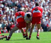 29 June 1997; Stephen Lawn of Tyrone in action against David O'Neill and Anthony Tohill of Derry during the Ulster GAA Football Senior Championship Semi-Final match between Tyrone and Derry at St. Tiernach's Park in Clones, Monaghan. Photo by David Maher/Sportsfile