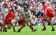 29 June 1997; Stephen Lawn of Tyrone in action against, from left, Johnny McBride, David O'Neill, and Anthony Tohill of Derry during the Ulster GAA Football Senior Championship Semi-Final match between Tyrone and Derry at St. Tiernach's Park in Clones, Monaghan. Photo by David Maher/Sportsfile