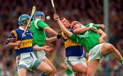 15 June 1997; In action, from left to right, Noel Sheehy of Tipperary, Shane O'Neill of Limerick, Paul Shelly of Tipperary and TJ Ryan of Limerick during the Munster GAA Senior Hurling Championship Semi-Final match between Tipperary and Limerick at Semple Stadium in Thurles. Photo by Ray McManus/Sportsfile