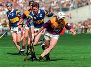 17 August 1997; Tom Dempsey of Wexford in action against Conor Gleeson of Tipperary during the GAA All-Ireland Senior Hurling Championship Semi-Final match between Tipperary and Wexford at Croke Park in Dublin. Photo by David Maher/Sportsfile