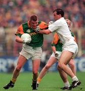 3 August 1997; Tommy Dowd of Meath holds off the challenge by Glenn Ryan of Kildare during the Leinster GAA Senior Football Championship Semi-Final Second Replay match between Kildare and Meath at Croke Park in Dublin. Photo by Ray McManus/Sportsfile