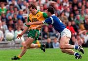 22 June 1997; Tony Boyle of Donegal in action against Damien O'Reilly of Cavan during the Ulster GAA Football Senior Championship Semi-Final match between Cavan and Donegal at St. Tiernach's Park in Clones, Monaghan. Photo by David Maher/Sportsfile