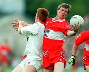 29 June 1997; Tony Scullion of Derry in action against Ciaran McBride of Tyrone during the Ulster GAA Football Senior Championship Semi-Final match between Tyrone and Derry at St. Tiernach's Park in Clones, Monaghan. Photo by Brendan Moran/Sportsfile