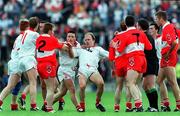 30 June 1996; Players from both the Derry and Tyrone Teams, including Peter Canavan of Tyrone, centre, who was later sent off, have a heated exchange during the Ulster Senior Football Championship Semi-Final at St Tiernach's Park in Clones. Photo by David Maher/Sportsfile