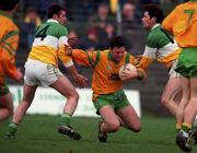 14 March 1999; Barry Ward of Donegal in action against Sean Grennan, left, ond Vinny Claffey of Offaly during the Church and General National Football League Division 1 match between Offaly and Donegal at O'Connor Park in Tullamore, Offaly. Photo by Matt Browne/Sportsfile